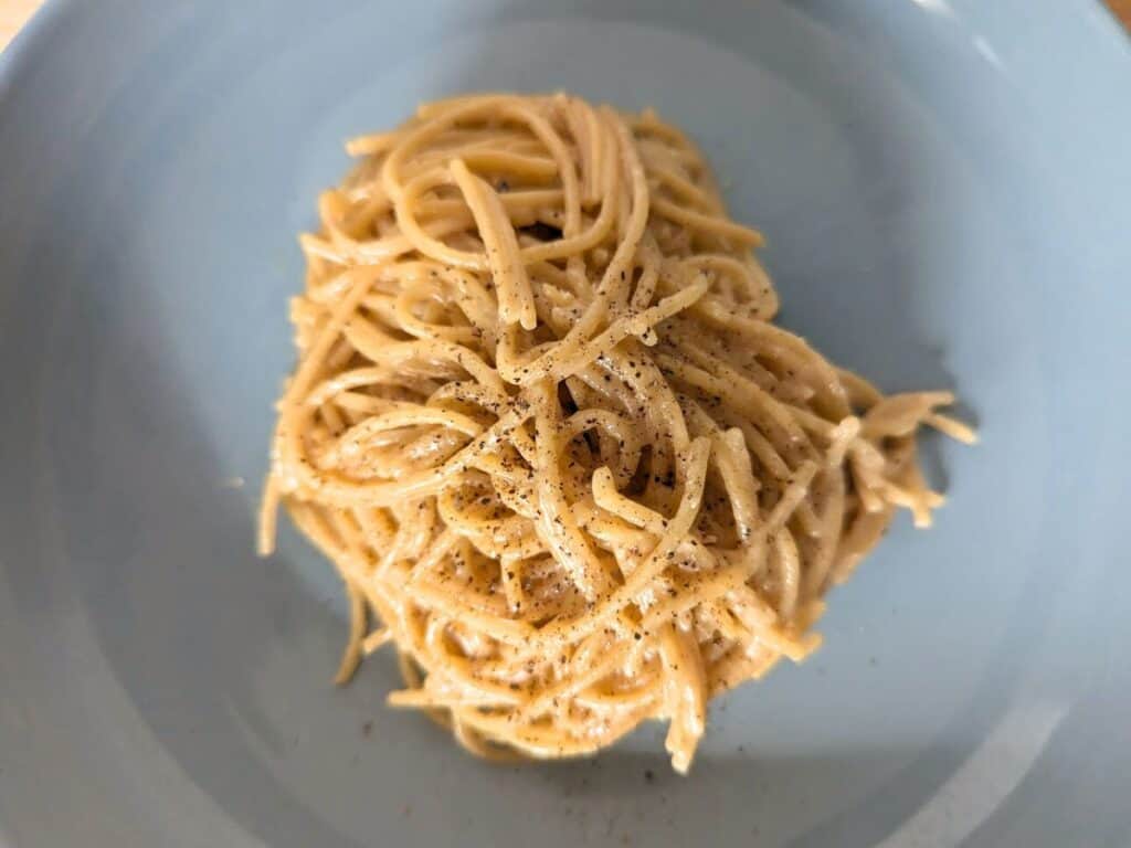 Image shows overhead of cooked lemon butter pasta.