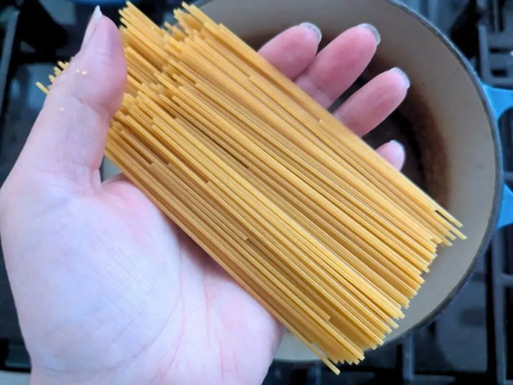 Image shows pasta broken in half.