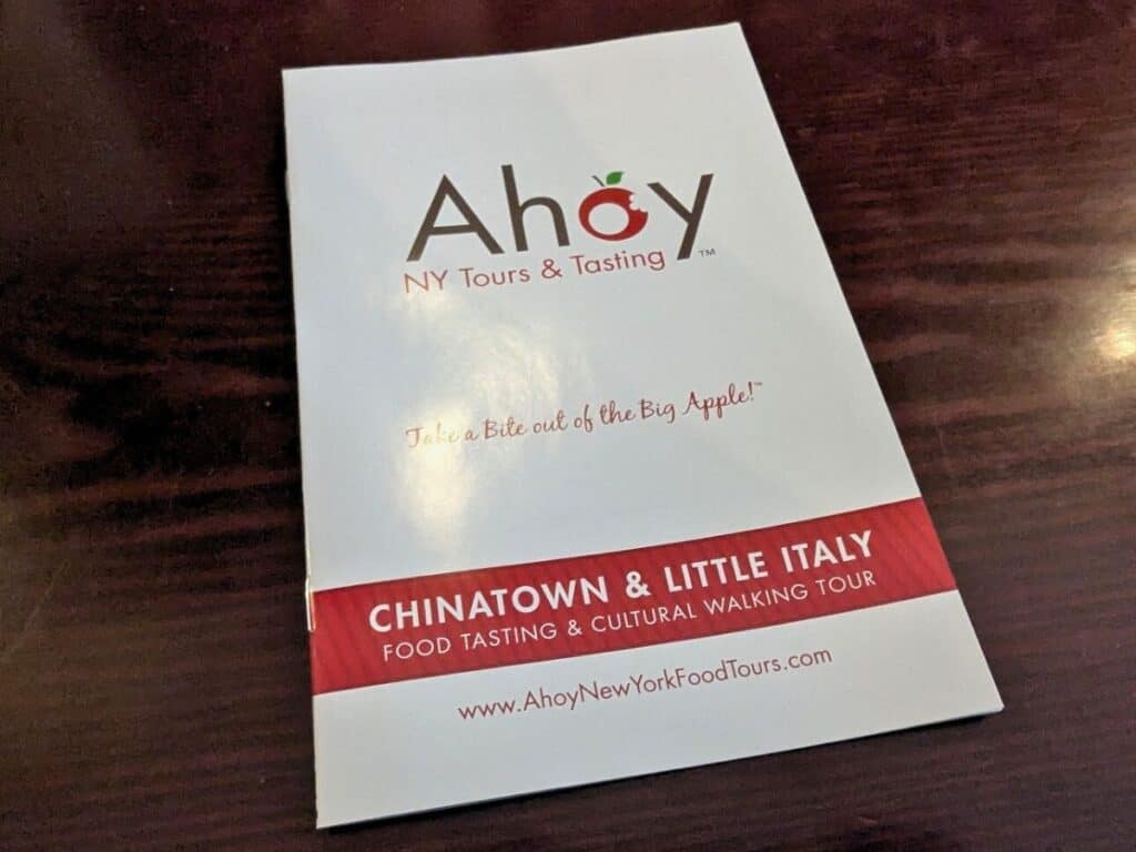 Image shows the pamphlet from Ahoy New York Tours and Tasting sitting on a table.