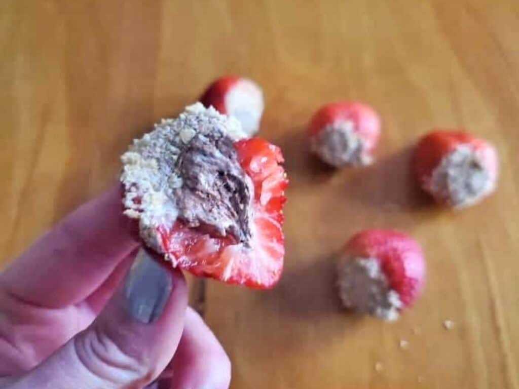 Image shows irresistible s'mores stuffed strawberries.